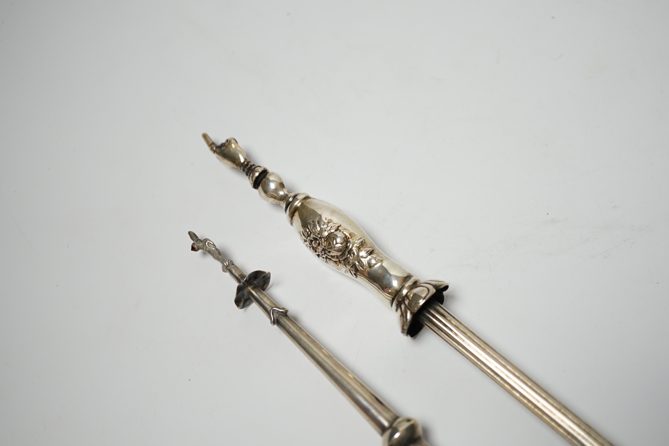 A late 19th century Russian 84 zolotnik torah pointer, with lion finial, 21.5cm and a plated example.